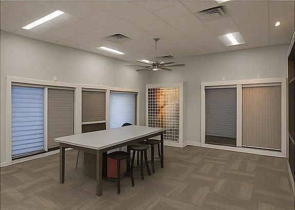 Gallery worktables and fixture displays after installation